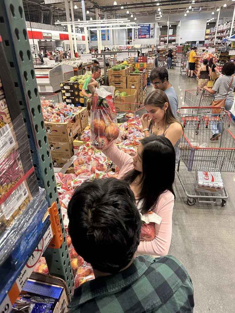 Picking out apples at Costco